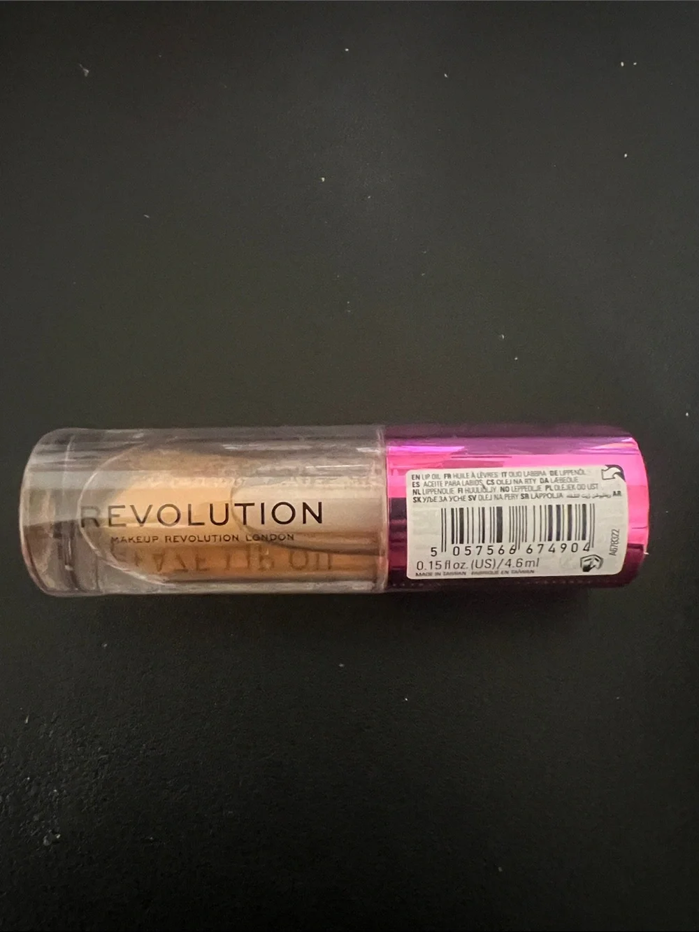 Revolution Metallic Gold Lip Oil with Pink Cap